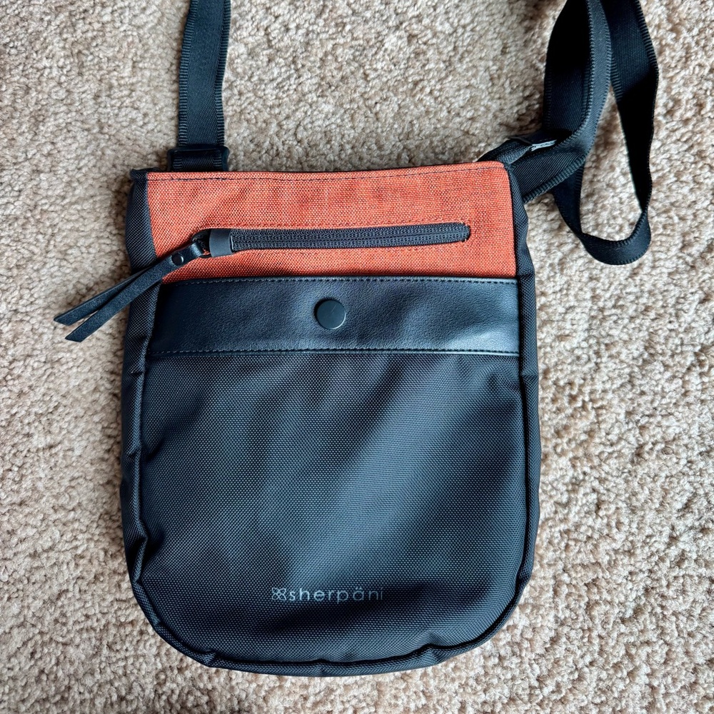 Sherpani Black & Orange Anti-Theft Travel Crossbody Bag with Modern Design NWOT
